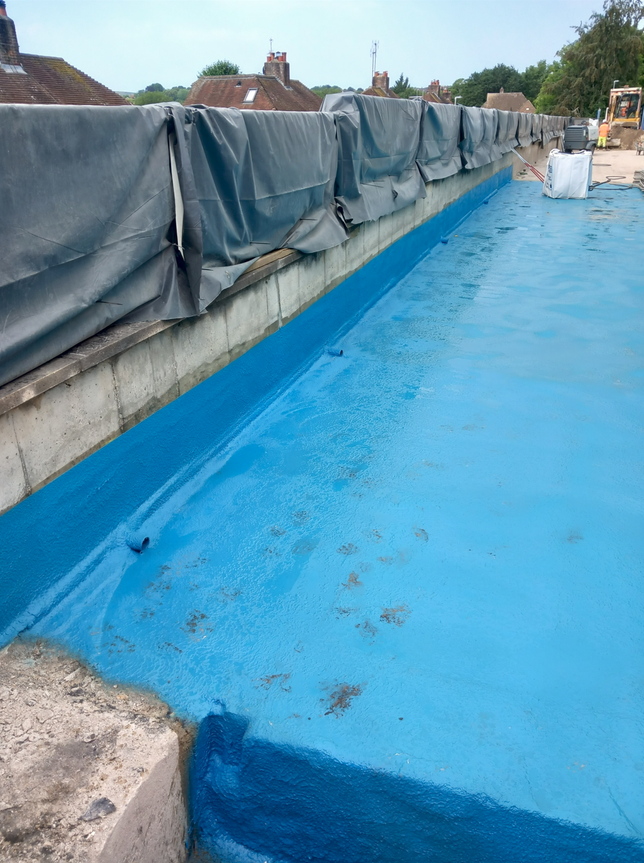 Application of spray applied waterproofing